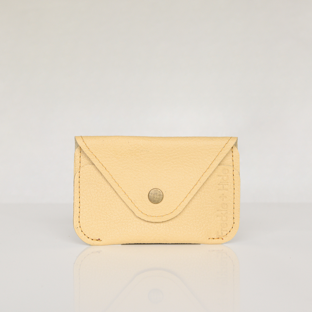 Yellow minimalist card wallet with antique brass popper