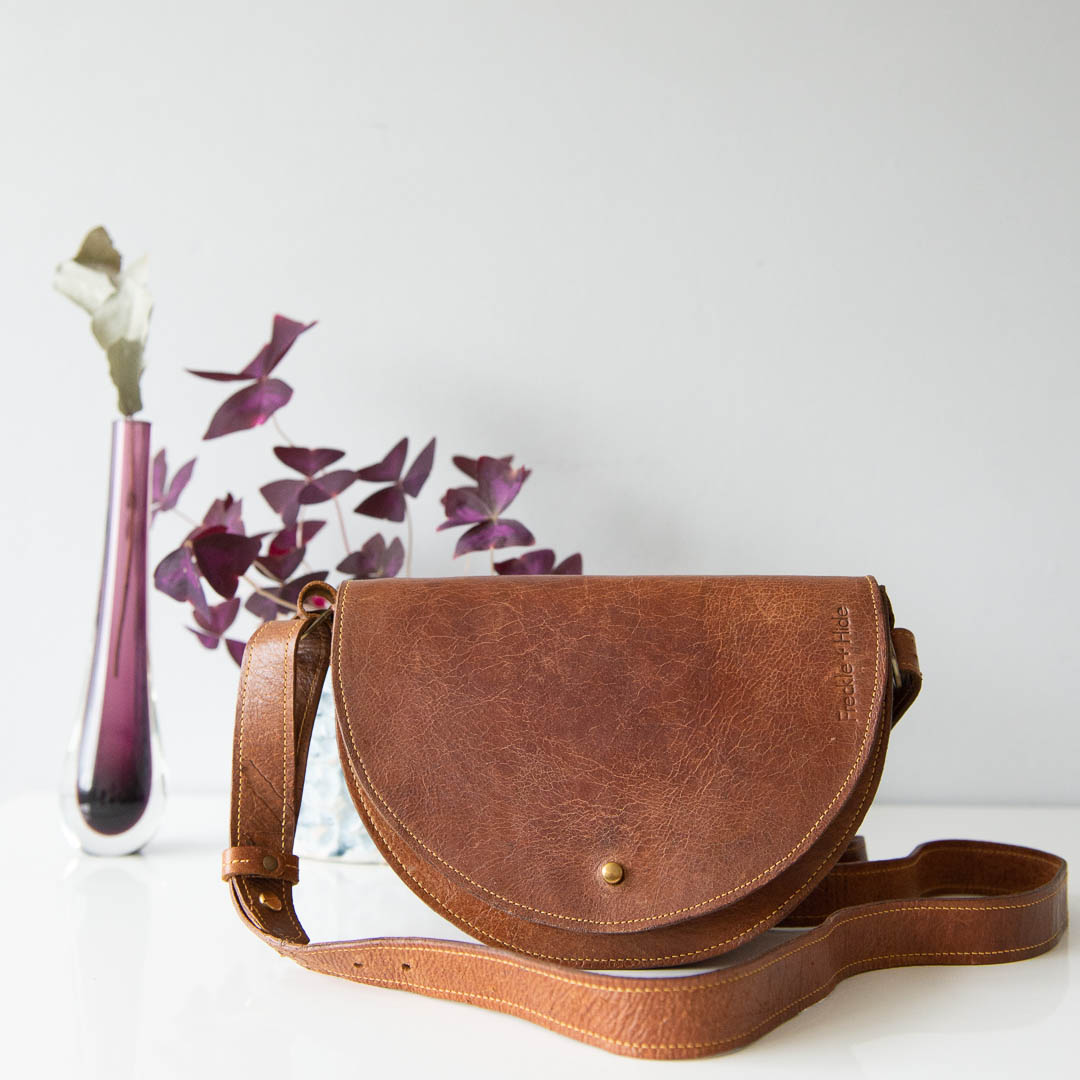 Brown upcycled leather cross body bag with yellow stitching